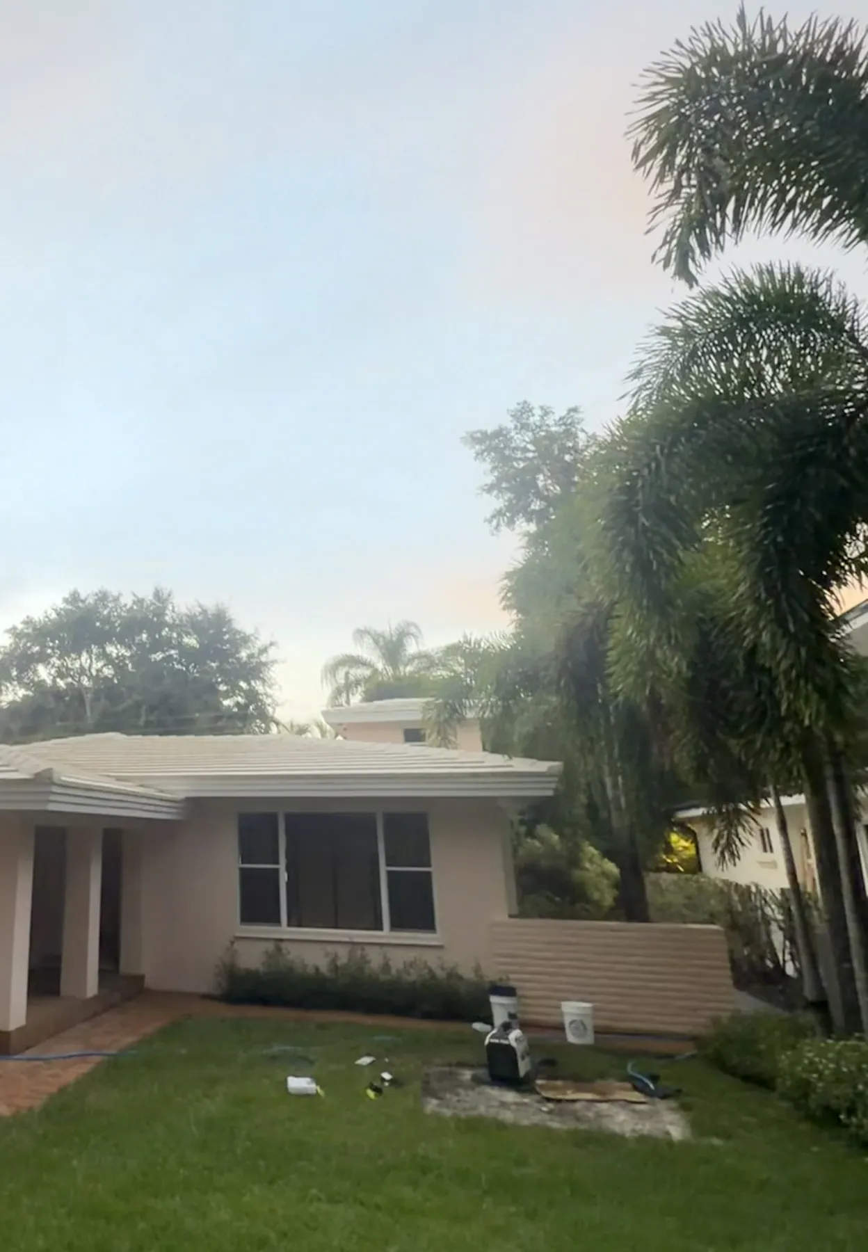 Project A finished house with the cleaned white tile roof and address cropped from view